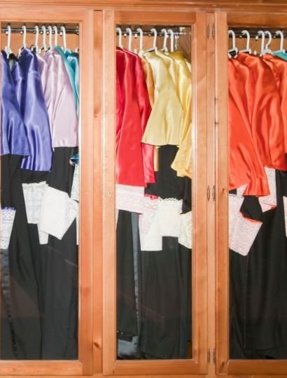 multicolored academic dress in wardrobe
