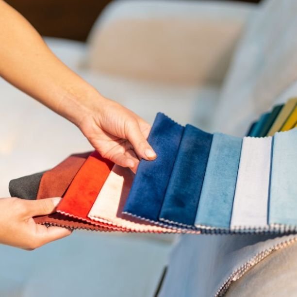 woman is selecting fabric for sofa